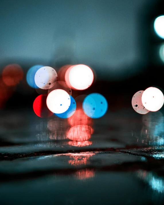 the view of a car driving down a street at night