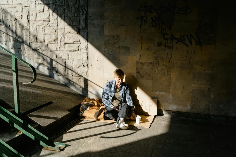 a boy and his dog are sitting by some concrete