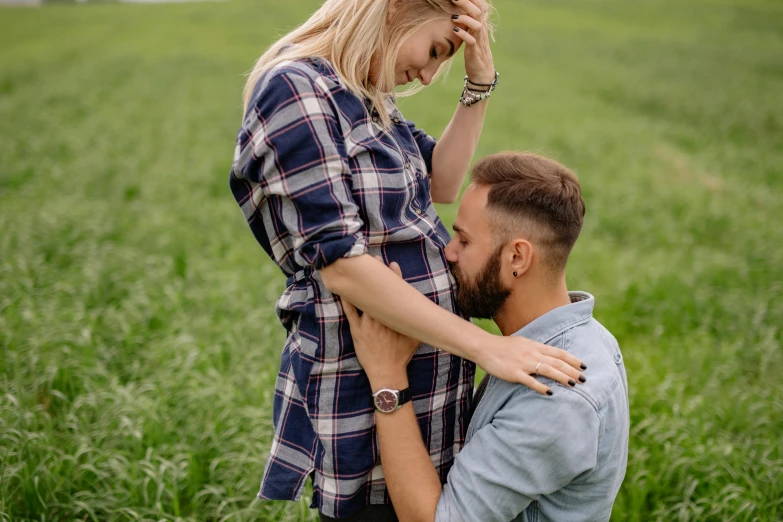 an image of a couple in the middle of a field