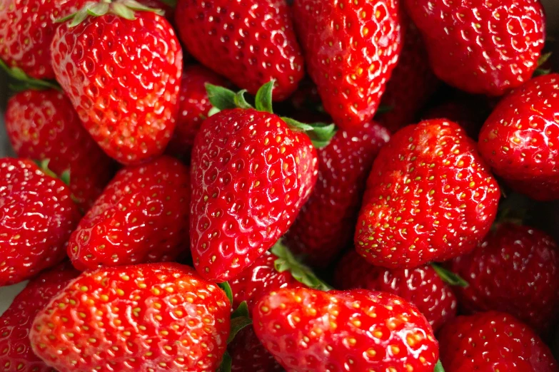 fresh strawberries that are on display at the store