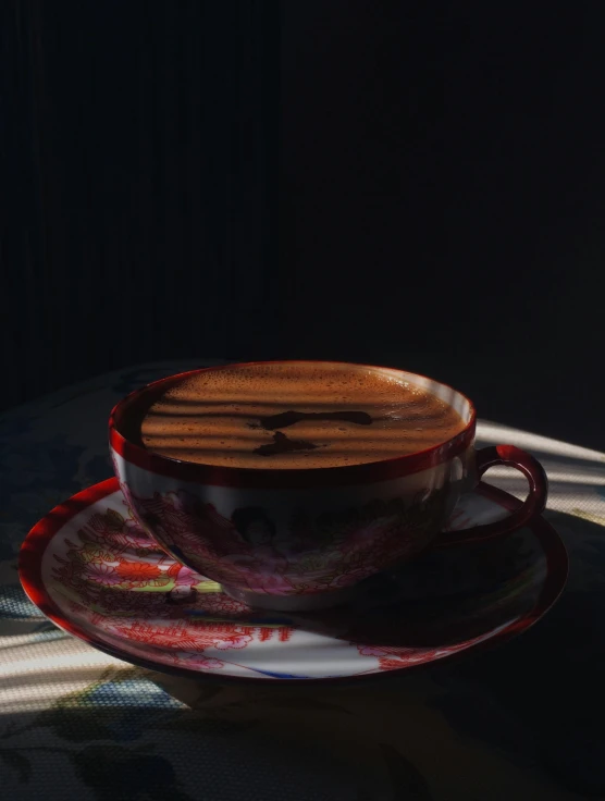 two cups of coffee sit on a saucer