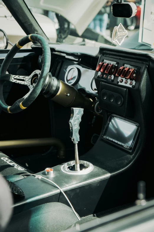 the inside of a classic car with a dash, radio and steering wheel