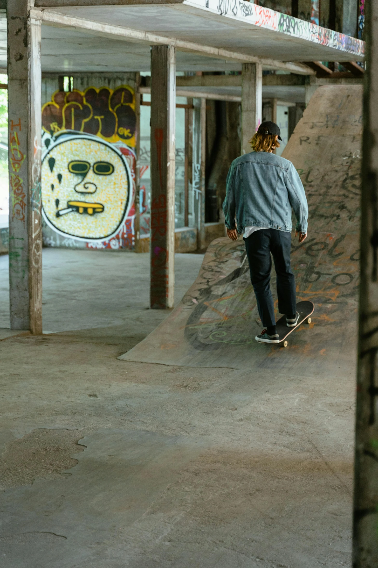 a person riding a skate board up the side of a ramp