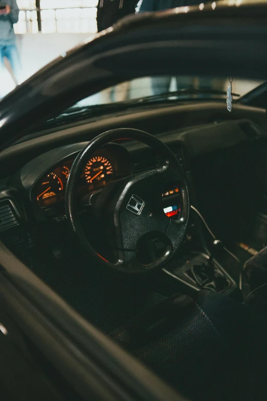 the interior of an old car parked on the street