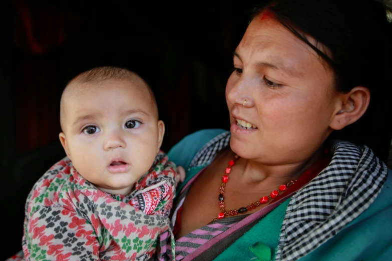 woman and baby looking at each other's eyes