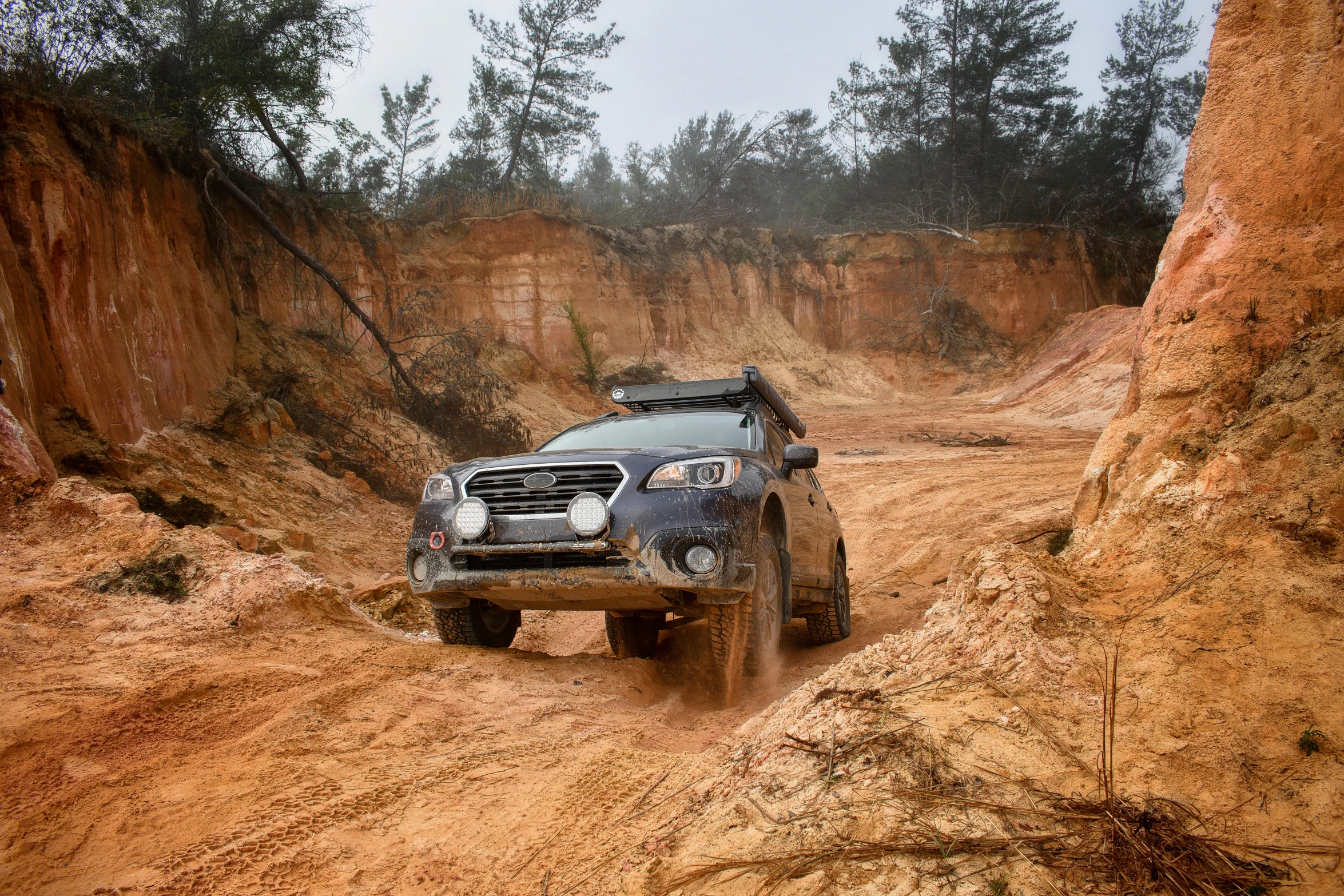 the car is driving in a very bad and dirty desert