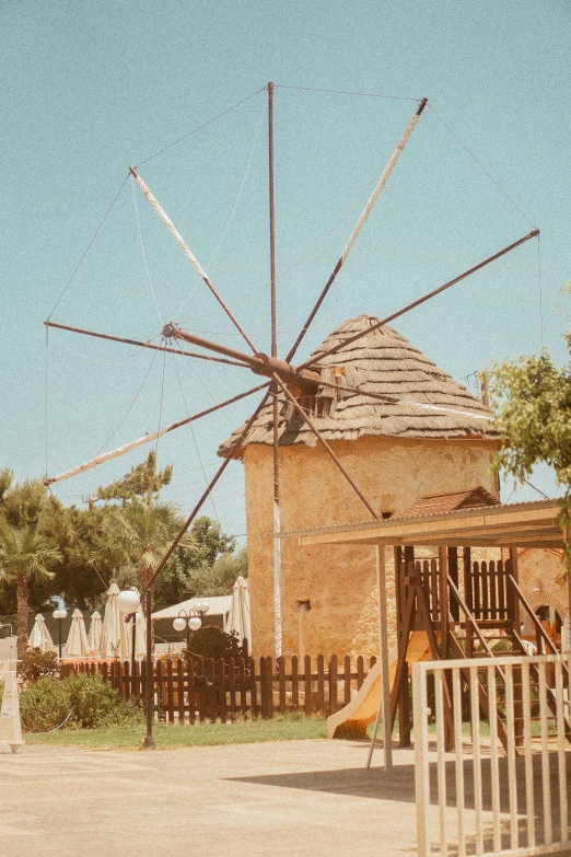 a small building with many sticks on top of it