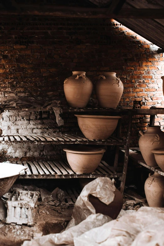 a brick oven with pots on top