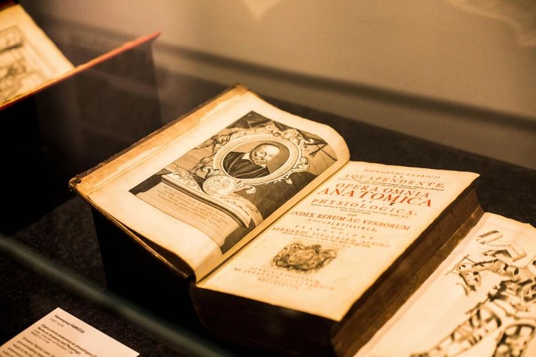 an opened book sitting on top of a table