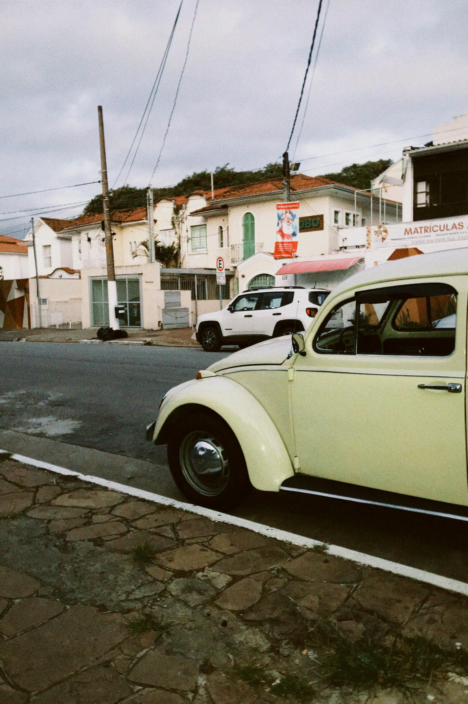 an old beetle car is parked in a lot