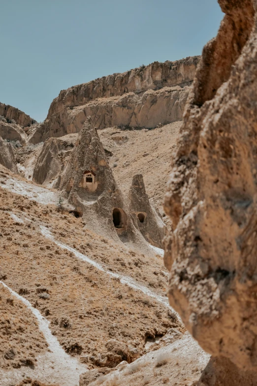 the mountains are dotted with sp vegetation, rocks and snow