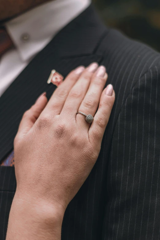 a man and a woman holding hands