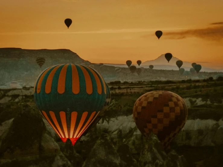 a number of  air balloons flying in the sky