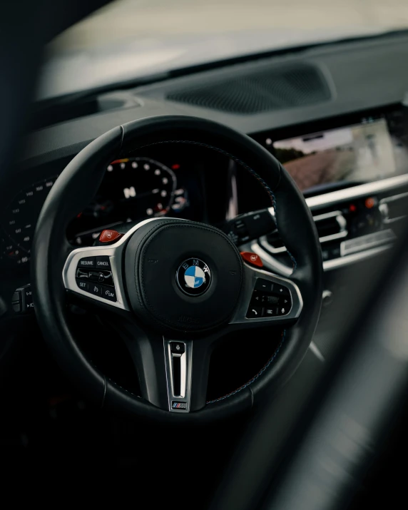 a bmw sports utility vehicle driving in the dark