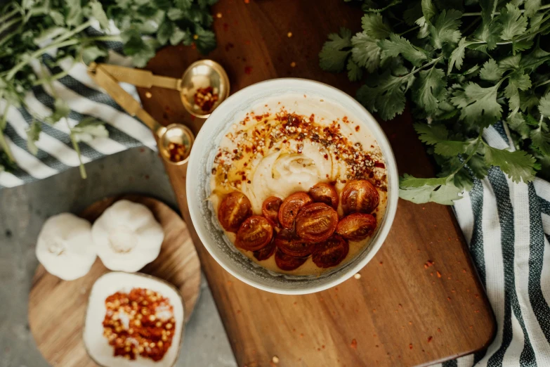 a bowl of baked goods sitting on a  board