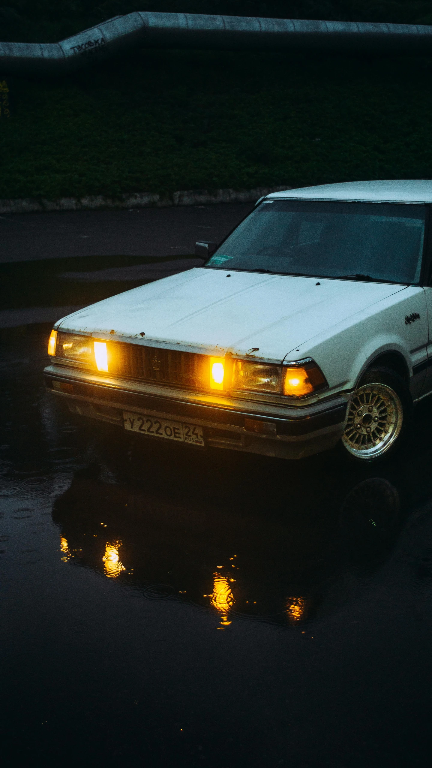 a car that is in the street lit up at night