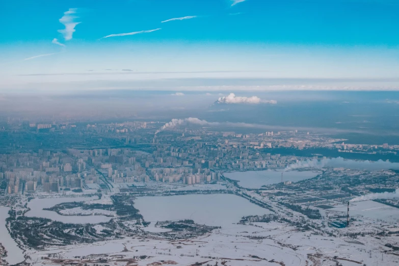 an airplane is flying above the snow - covered area