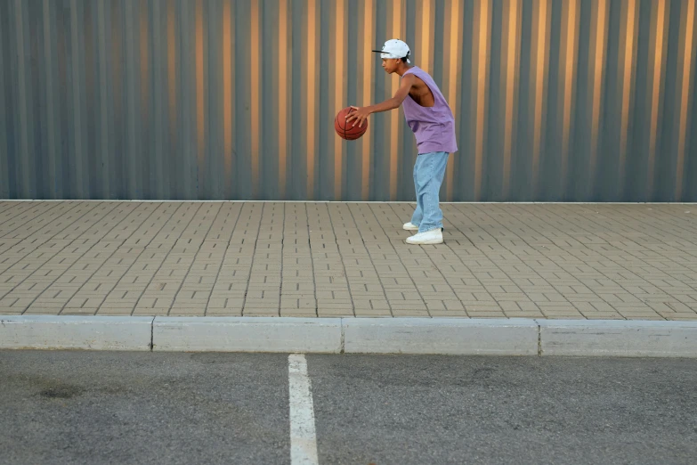 the young man is playing with a ball