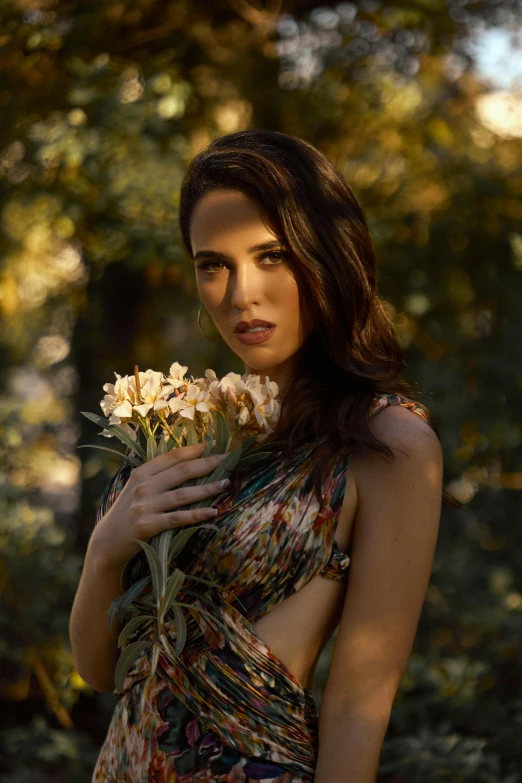 the woman has flowers in her hand by herself