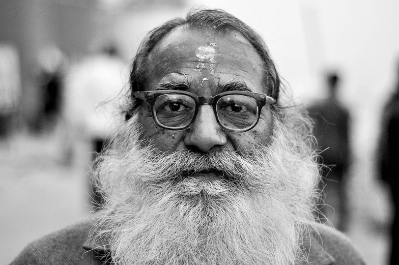 black and white pograph of old man with eye patches