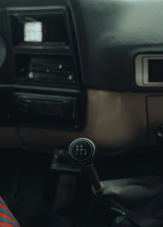 there is a black radio on the dashboard