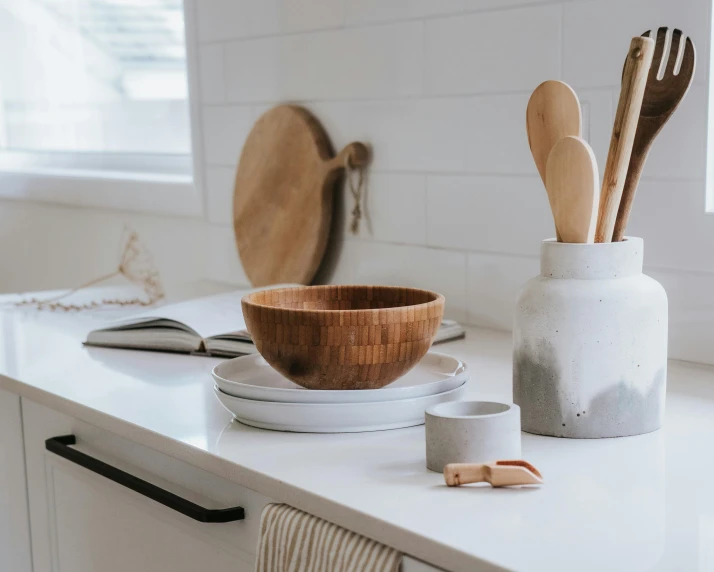 a counter top with some plates and bowls