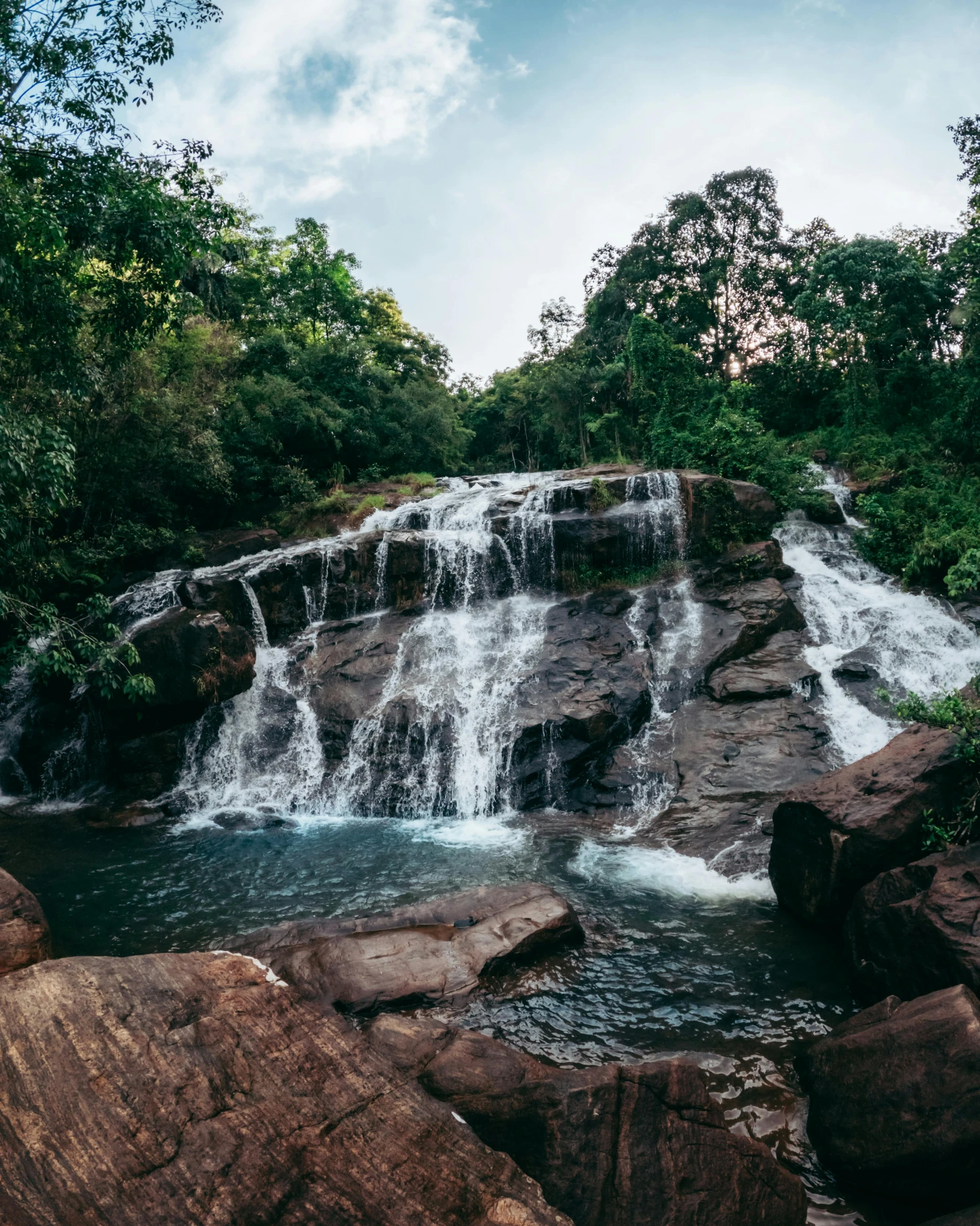 there is a waterfall that goes down the rocks