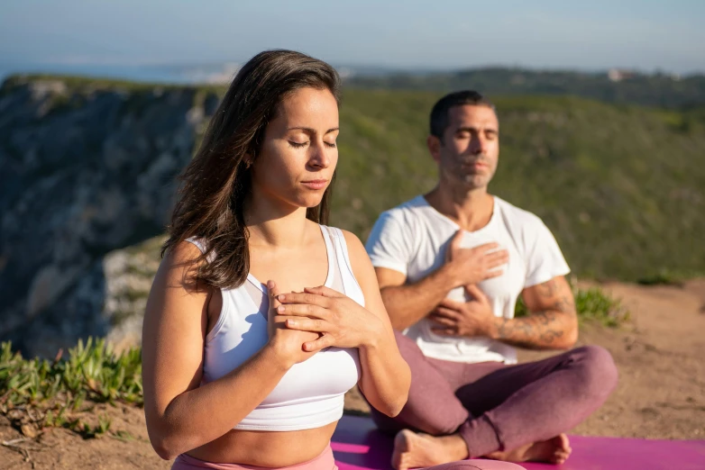 two men and a woman in the middle of yoga