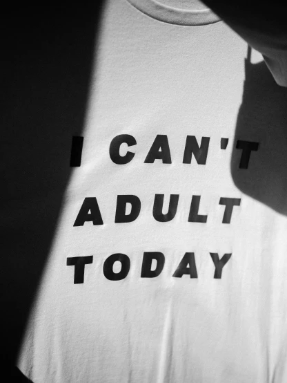 a person wearing an i can't adult today shirt