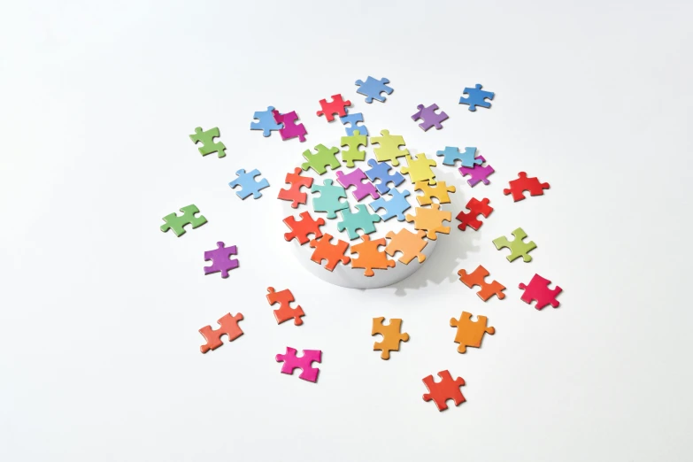 a bunch of different colored puzzle pieces