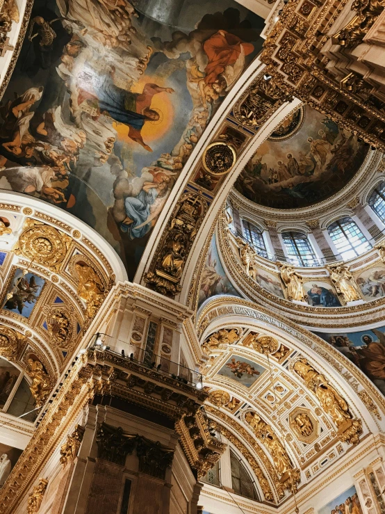 a church with elaborately designed ceilings and paintings on it