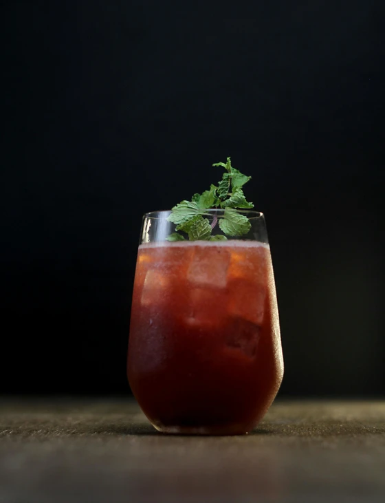 a cold drink sitting on top of a wooden table