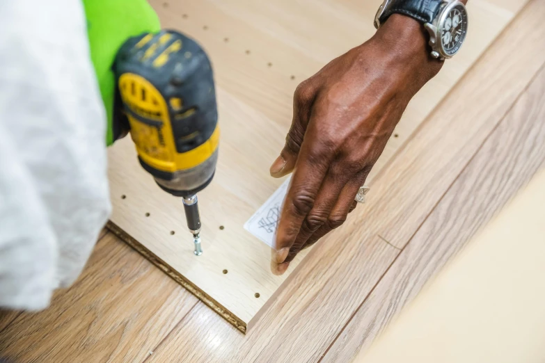 a person in a work room working with the driller