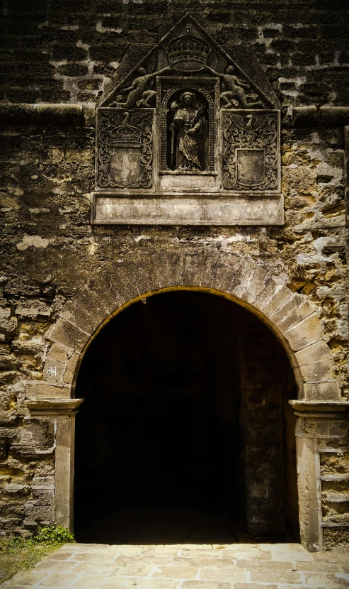 a gate is opened to a stone building