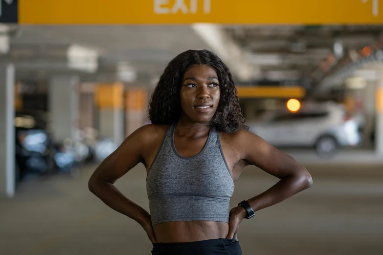 a young lady posing for a picture at an airport