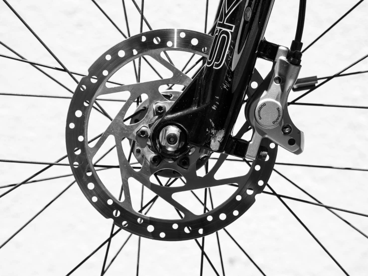 the rear rotor of a bicycle being mounted in the air