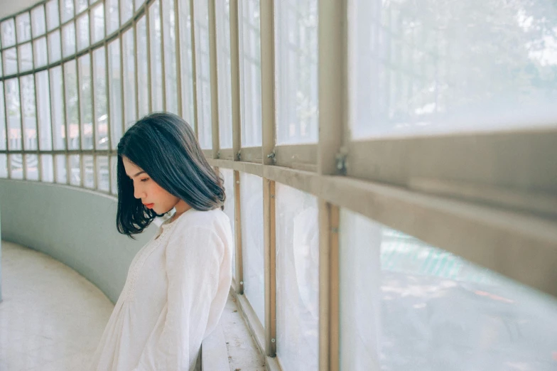 a woman looking over the fence at soing