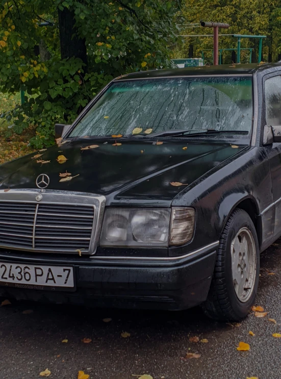 black car parked on the side of the road