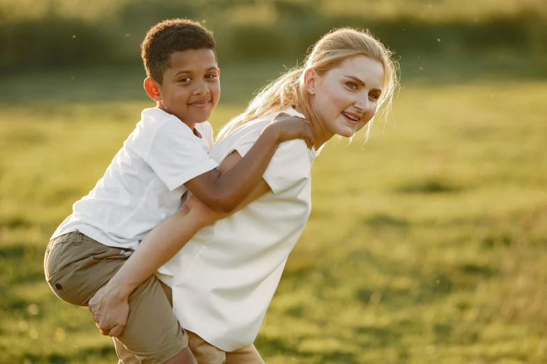 two children standing up with their arms in the air