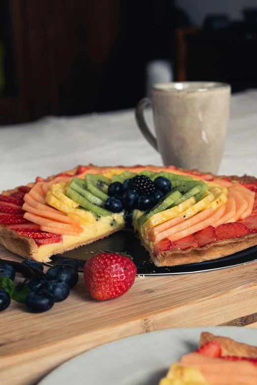 a rainbow dessert, cut into two pieces and served on the tray