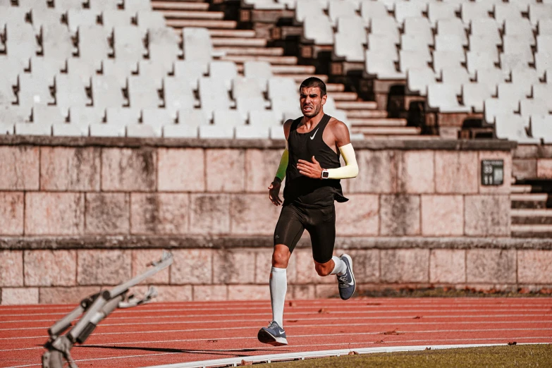 man in black outfit running by steps with his leg off