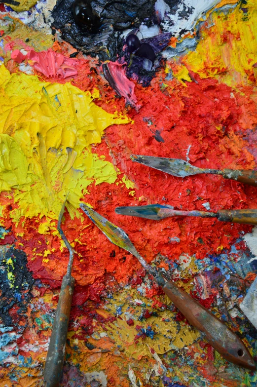 the paint colors are yellow and red and has various different brushes