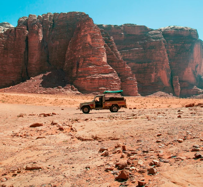 a jeep that is sitting in some dirt