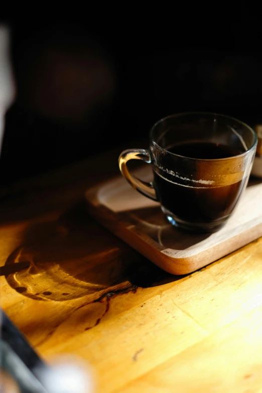 a cup of tea on a tray and some napkins