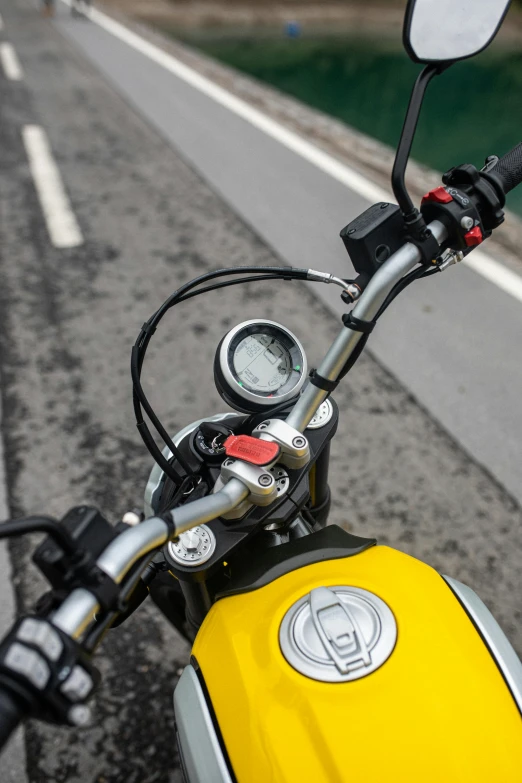 a close up view of a motorcycle driving down a road