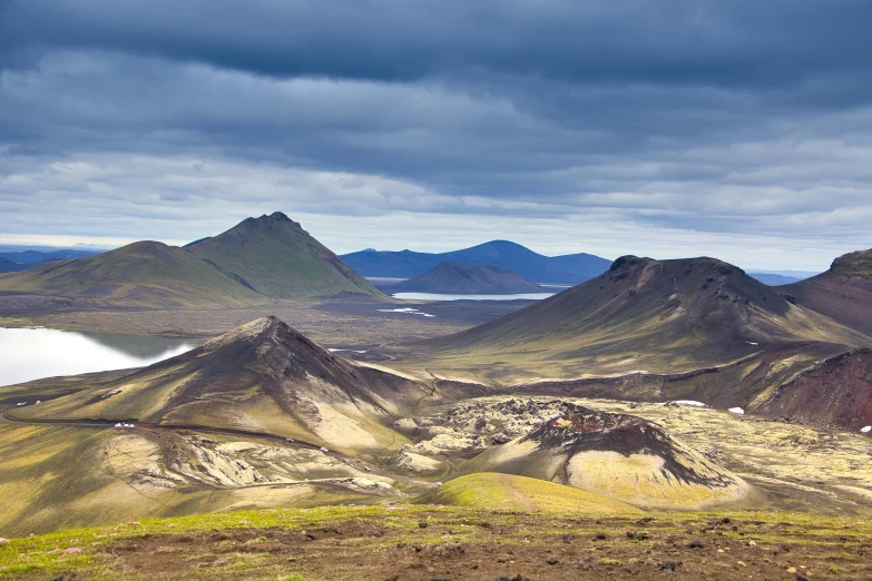 a mountain range with a body of water in the distance