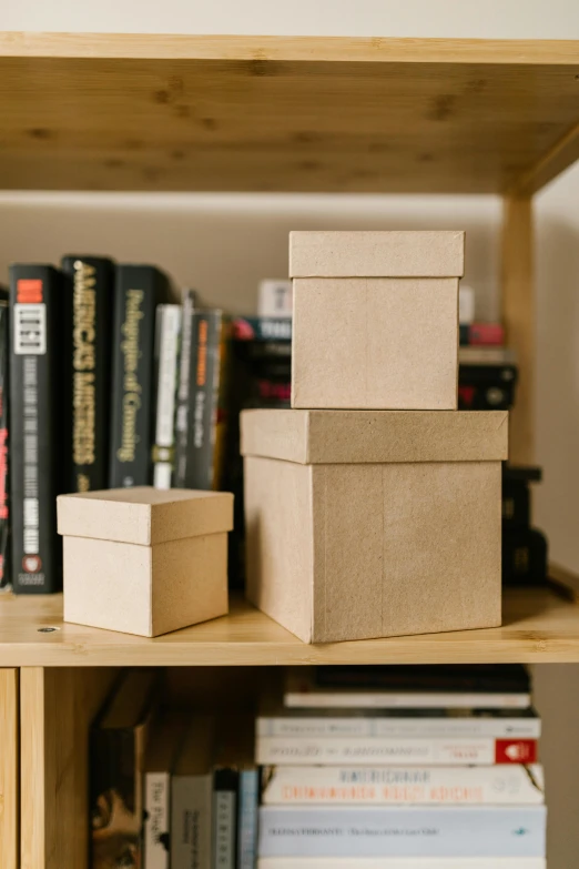 a shelf that has several boxes on it