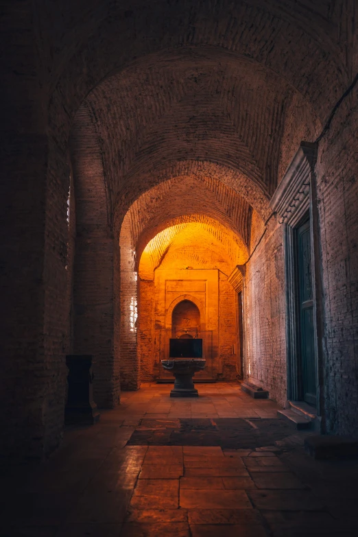 there is a brick hallway with arches on both sides