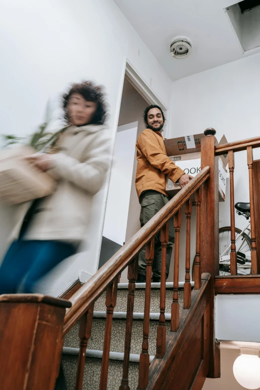 two people on the stairs of a house