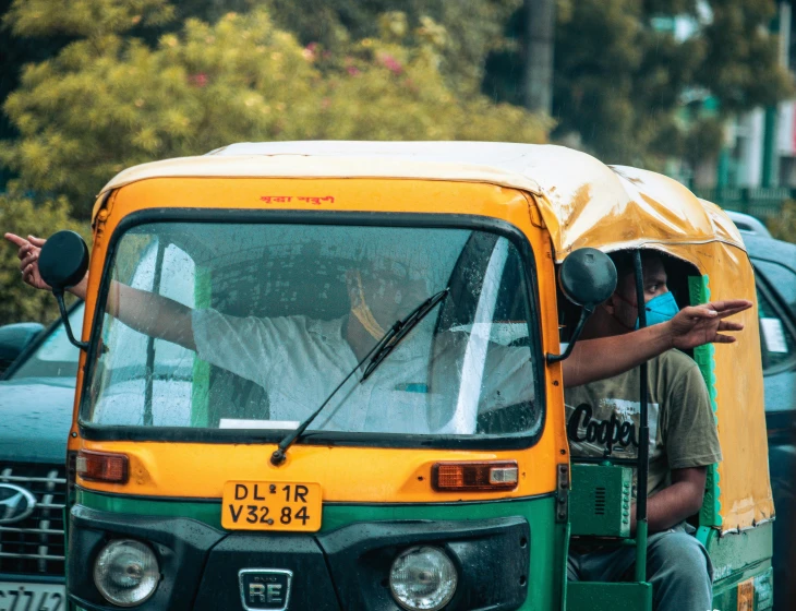 an image of a person in the driver's seat of a small bus